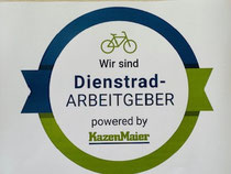 Das Logo des Dienstrad-Arbeitgeber. Zu sehen ist das Symbol einer Fahrrad mit der Aufschrift: Wir sind Dienstrad-Arbeitsgeber Powerd by Kanzen Maier