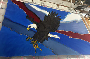 an eagle with golden keys coming down 