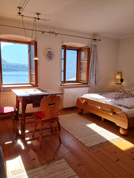 Interior of Apartment with a double bed and a dining table