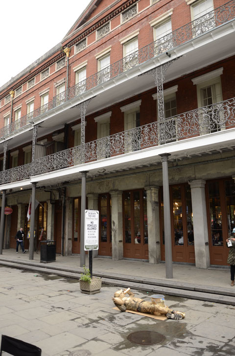 Street Artist and Historic Buildings on St. Ann Street photographed by Heidi Mergl Architect
