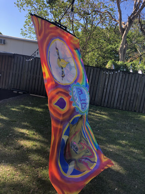 Large colorful silk flag with the faces of an eagle and a bull