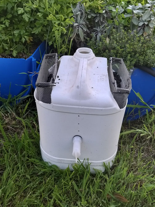 The 'Permafilter' standalone CDI unit (with biochar) next to my Permachar Kitchen Garden