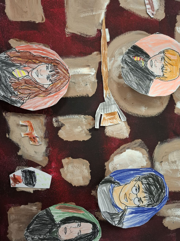 Bild mit ausgeschnittenen und buntbemalten Köpfen aus Harry Potter