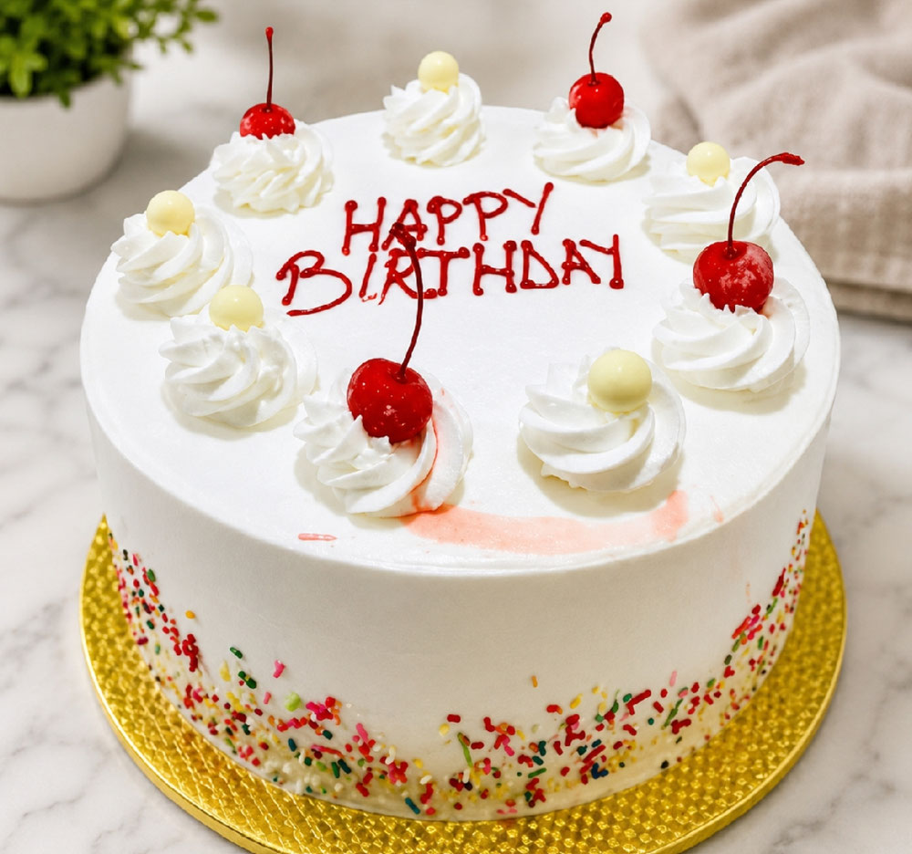 Sweet Celebration Birthday Cake A classic white birthday cake topped with whipped cream swirls, bright red cherries, and colorful sprinkles, finished with a touch of pure love. Crafted to make every birthday memorable, this delightful cake brings sweetness, joy, and celebration to every special moment. 