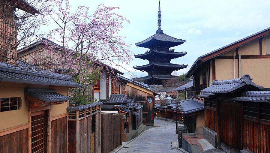 Historic Kyoto street with classic traditional architecture and a busier sightseeing atmosphere.