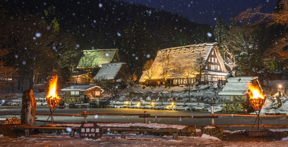 Snow-covered houses at Hida Folk Village in winter.