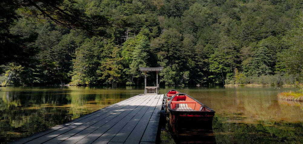 Myojin area in Kamikochi with quiet forest and mountain scenery.