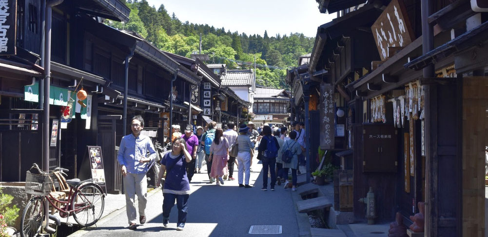 Traveler-friendly street in central Takayama with traditional buildings and clear walking paths.