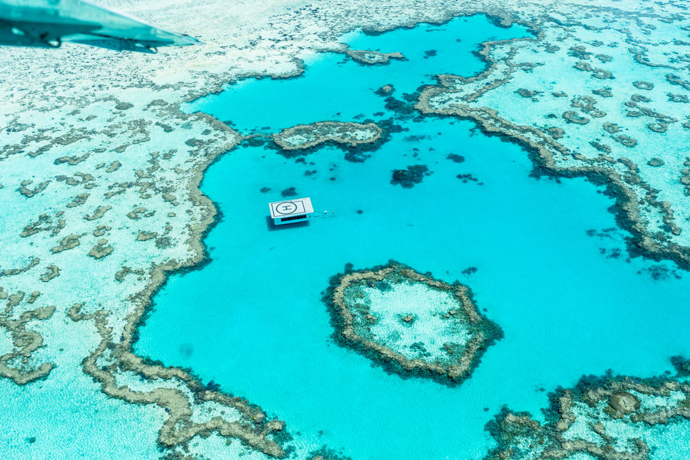 Aerial of Great Barrier Reef with helicopter platform in Australia