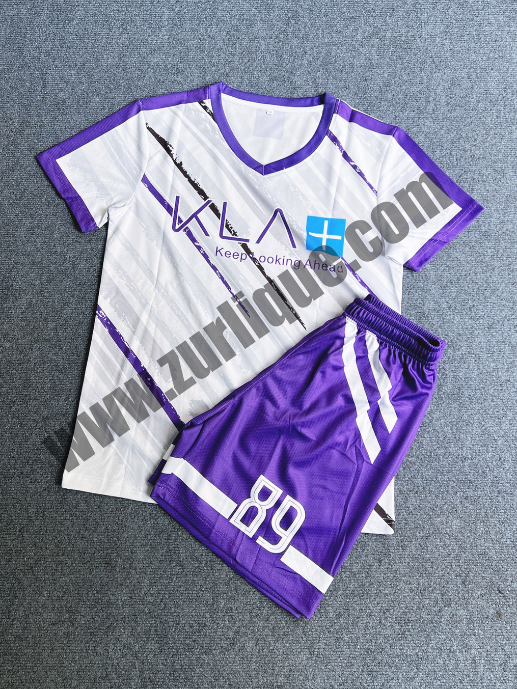 Custom full sublimation football jersey with matching shorts for KLA Singapore, featuring purple and white design with number 89, produced by Zurlique.
