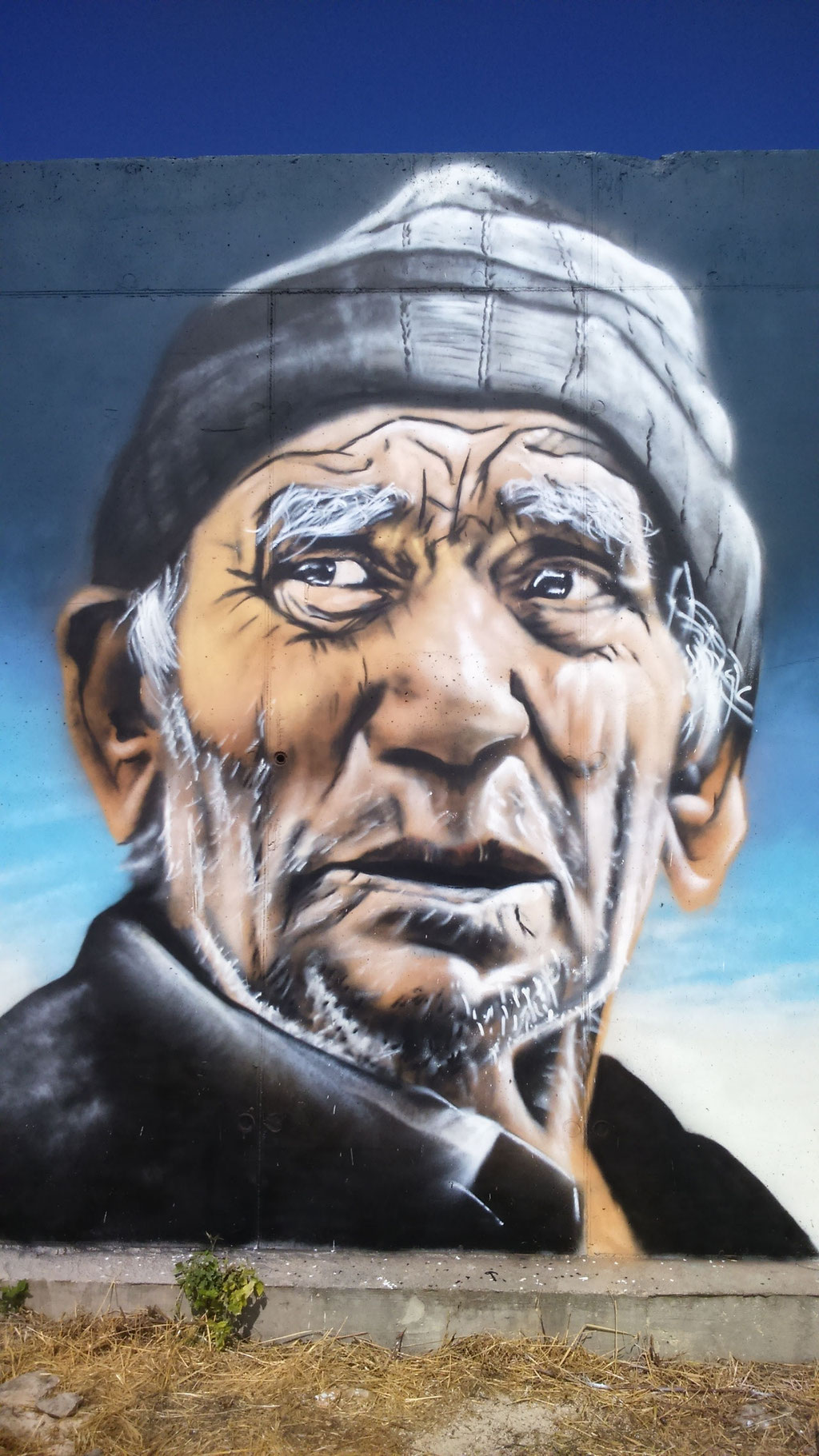 fresque street art d'un portrait d'homme à Bissey-la-Côte, Coron Thibaud