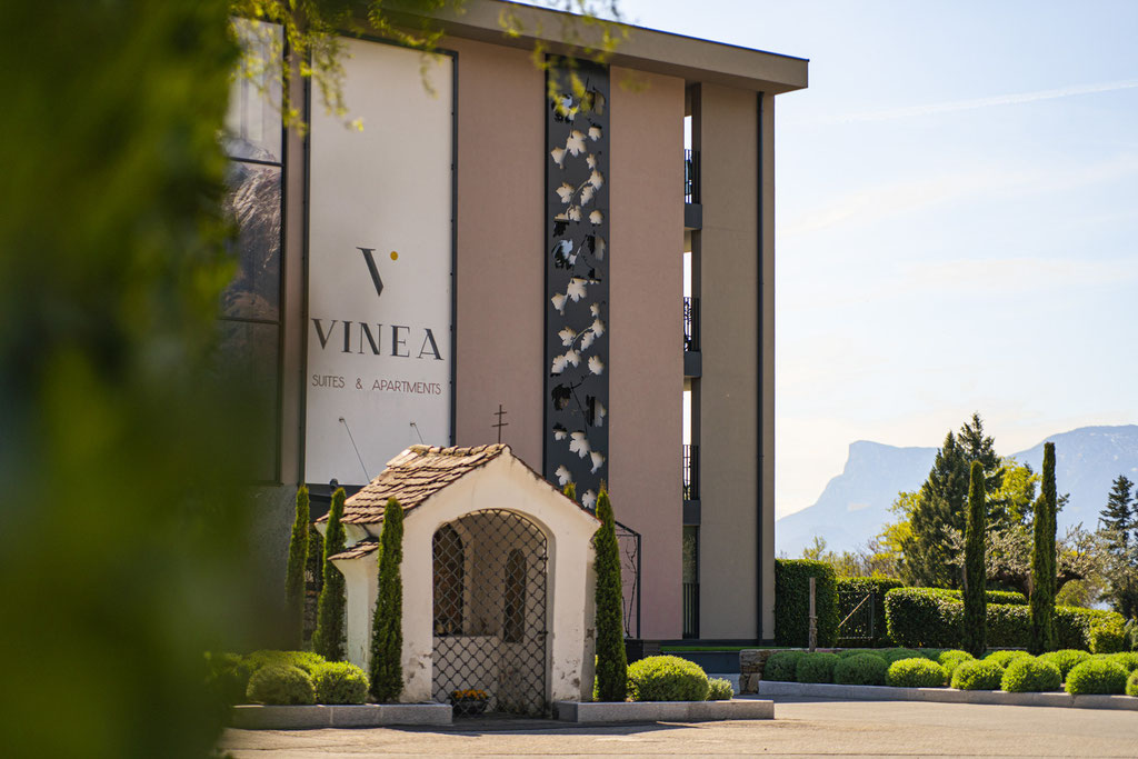 Boutique aparthotel VINEA with the historic chapel in Dorf Tirol, South Tyrol