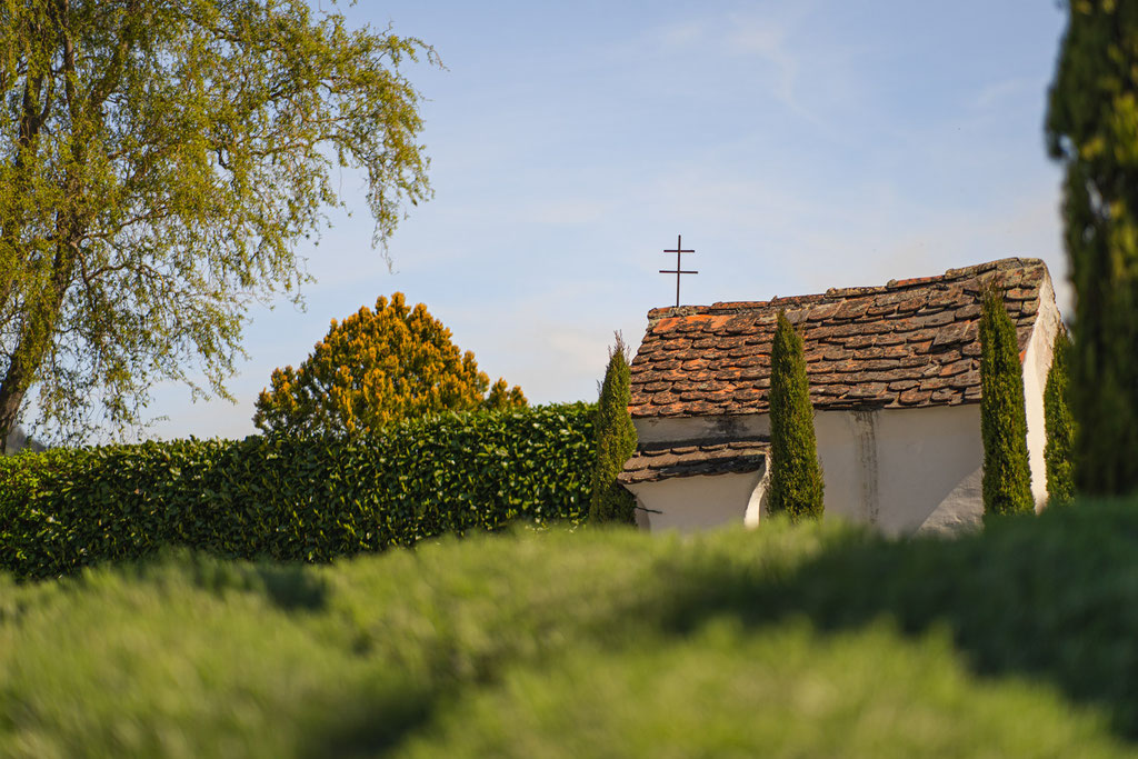 Historic chapel in front of VINEA Suites & Apartments in Dorf Tirol, South Tyrol