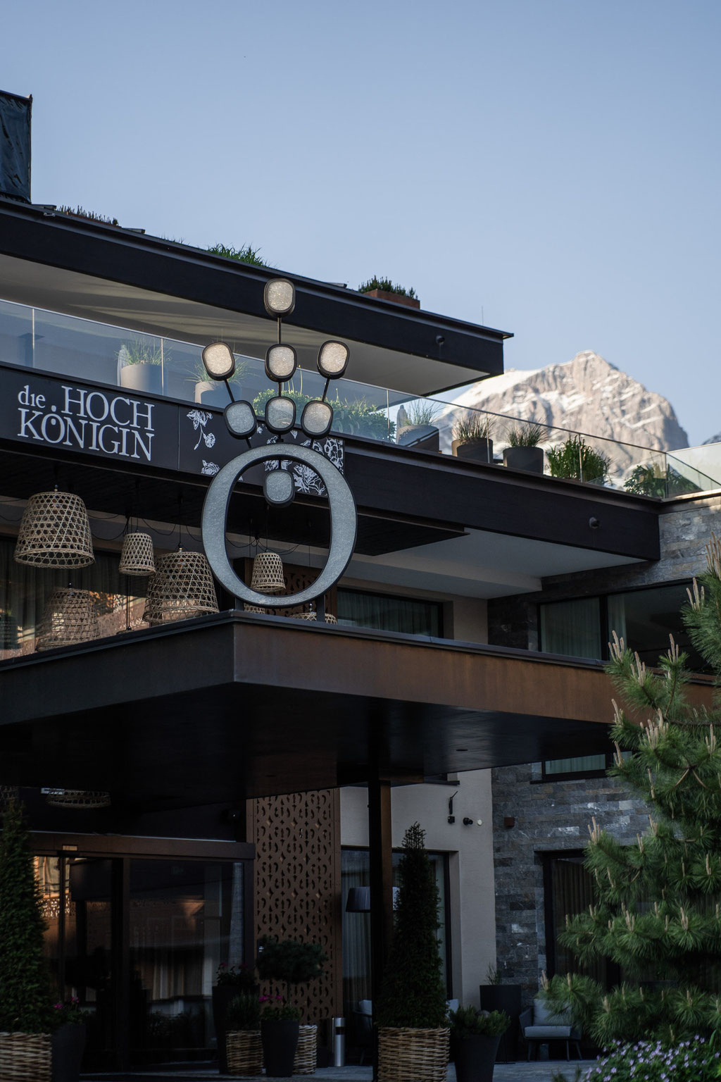 Modern entrance area of the Hochkönigin Wellness Hotel in Maria Alm, Salzburg, with mountain views