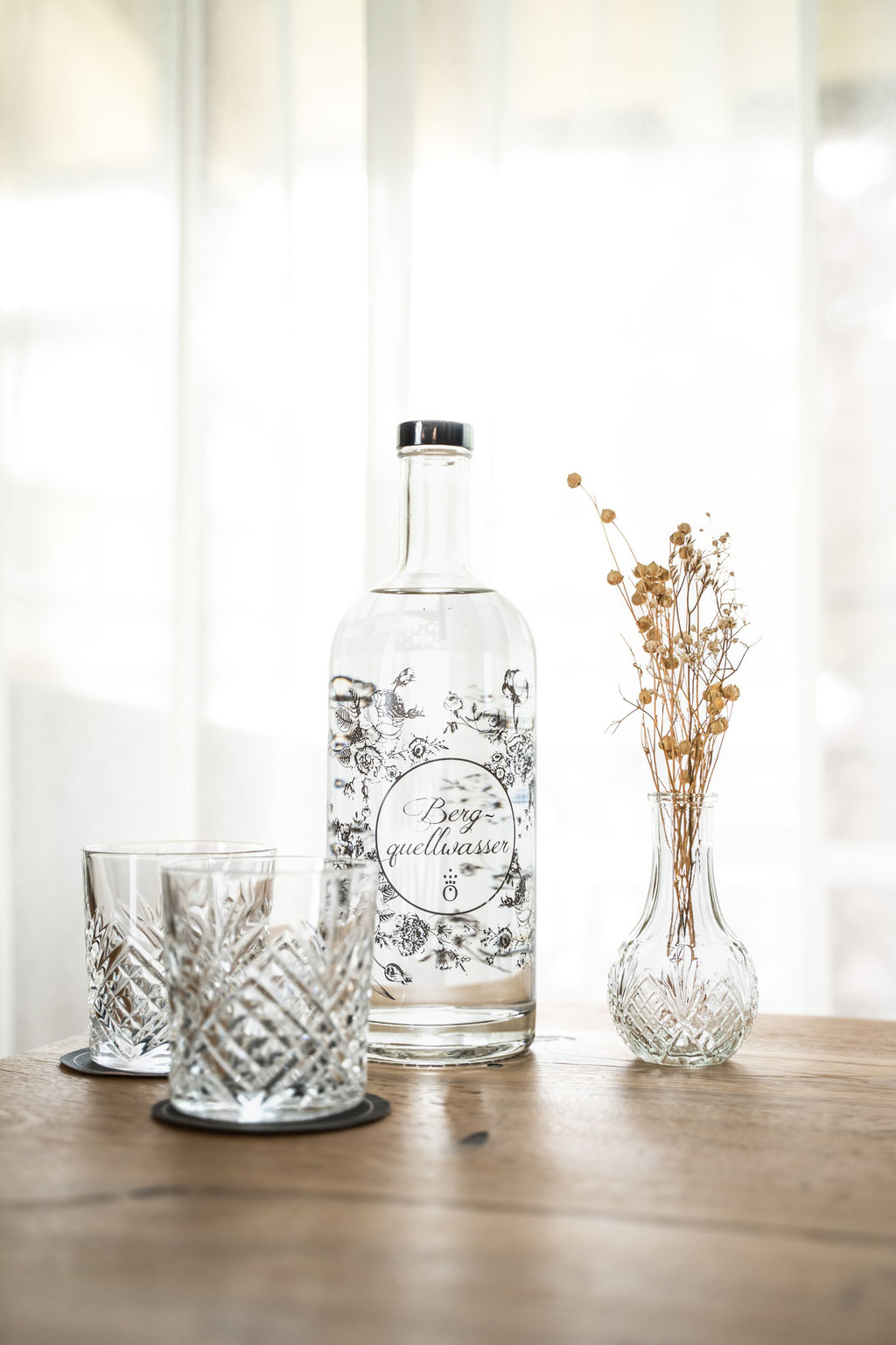 Mountain spring water and glasses as a welcome gesture at the Hochkönigin Wellness Hotel in Maria Alm, Salzburg
