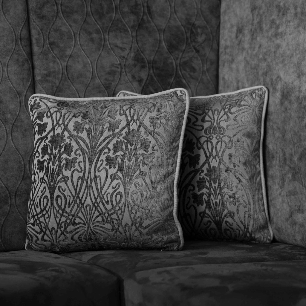 Decorative cushions in the stylish lounge area of the Hochkönigin Wellness Hotel in Maria Alm, Salzburg