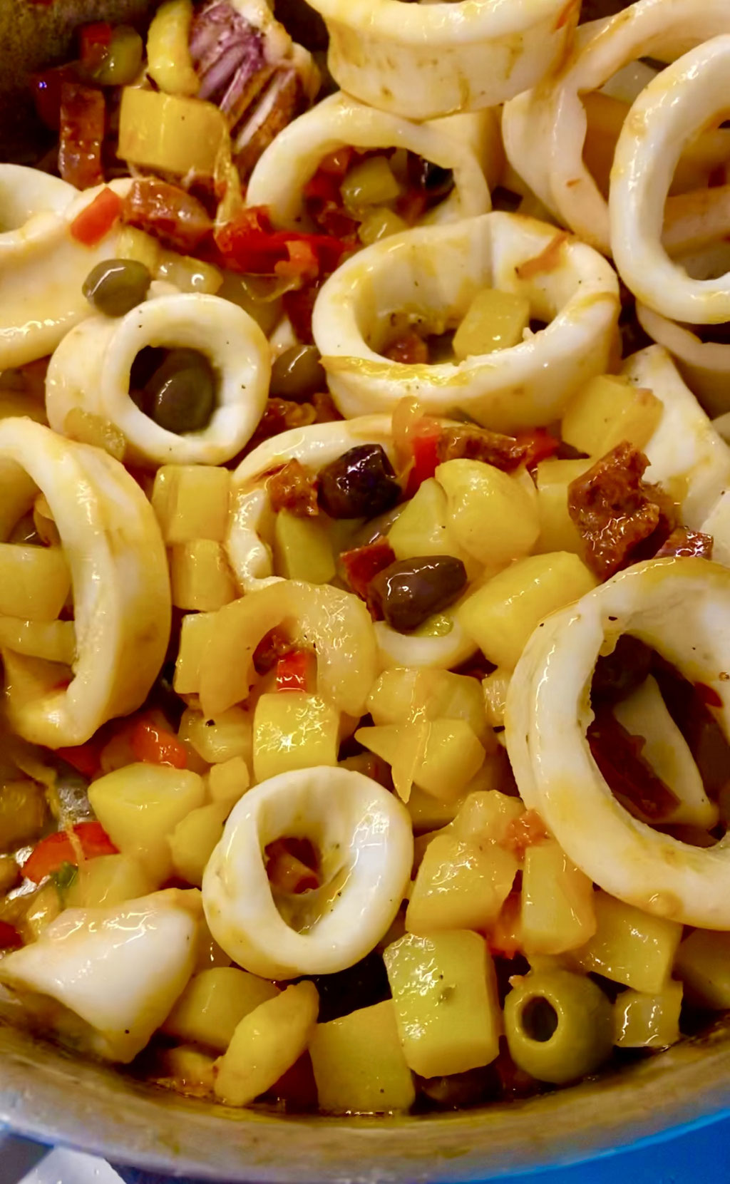 Sautéed calamari with olives, hot peppers and potatoes by ZsL