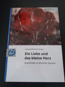 Foto vom Buch, unten weiß mit Titel: Die Liebe und das kleine Herz, oben Gemälde mit Herz