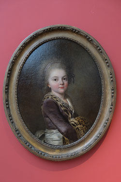 Adolf Ulrik Wertmüller, Portrait presumed to be of Émilie Charton, 1781. Musee des Beaux-Arts Nancy. Photo: Epochs of Fashion. An oval oil portrait in gold frame showing the torso of a young lady wearing a purple dress with white sash and leopard trim. 