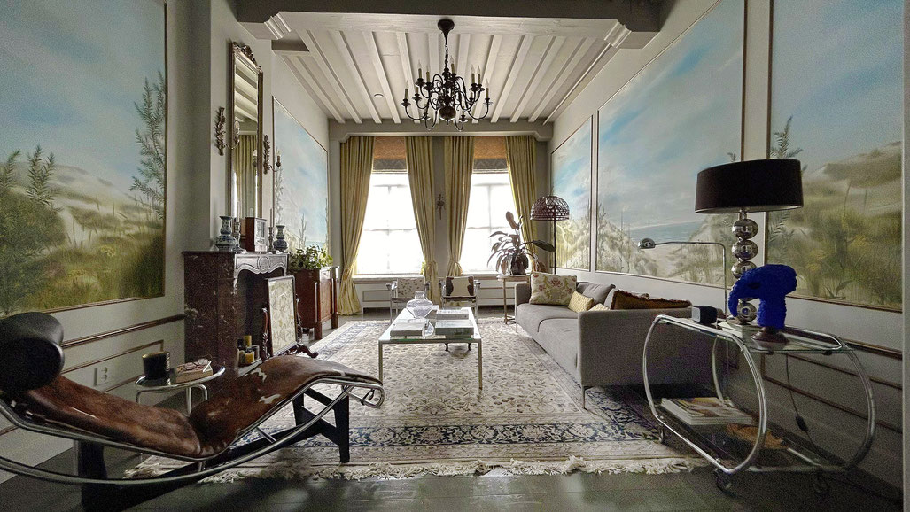 This historic room with hand-painted wallhangings with a landscape by wallpaperartists jaap snijder and marcelo gimenes