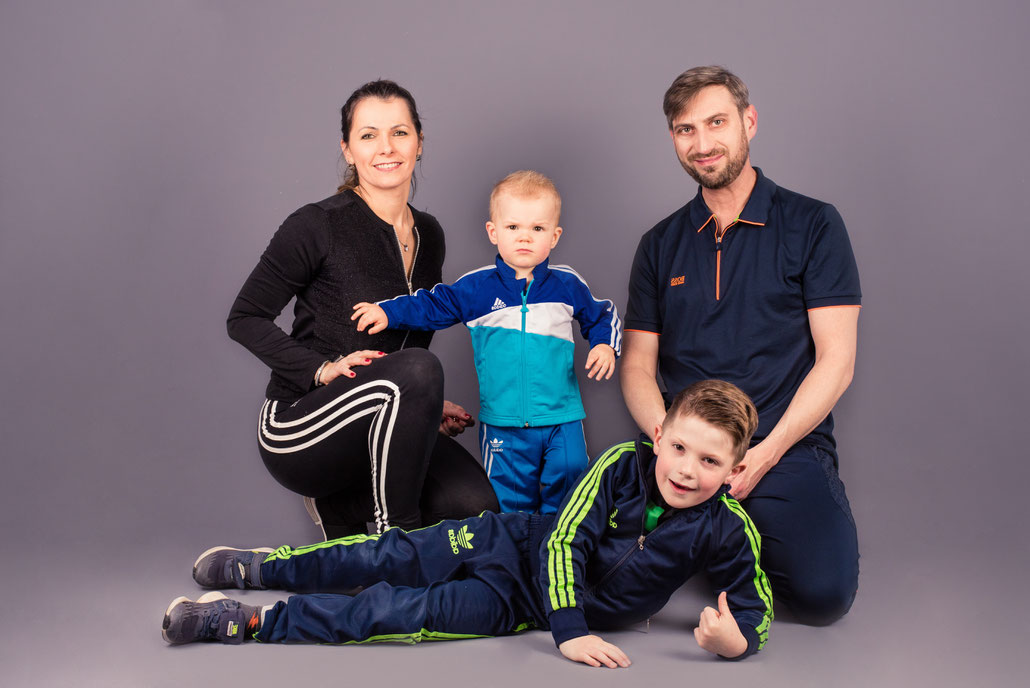 all family members in front of a camera