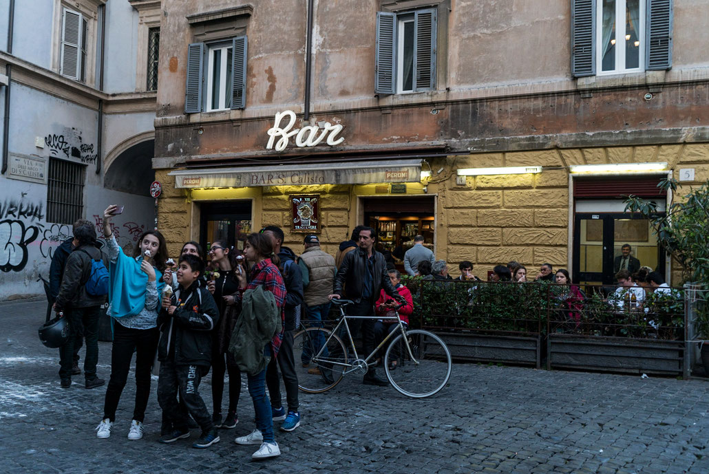 Youngster taking a selfie near bar in Rome