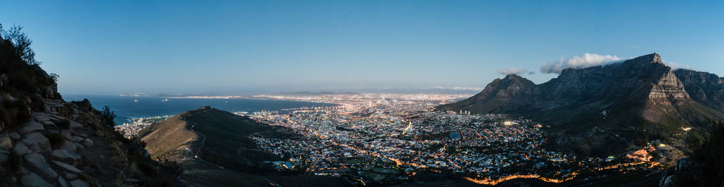 Table Mountain, Capetown city bowl and Signal hill seen from Lion's Head during dusk