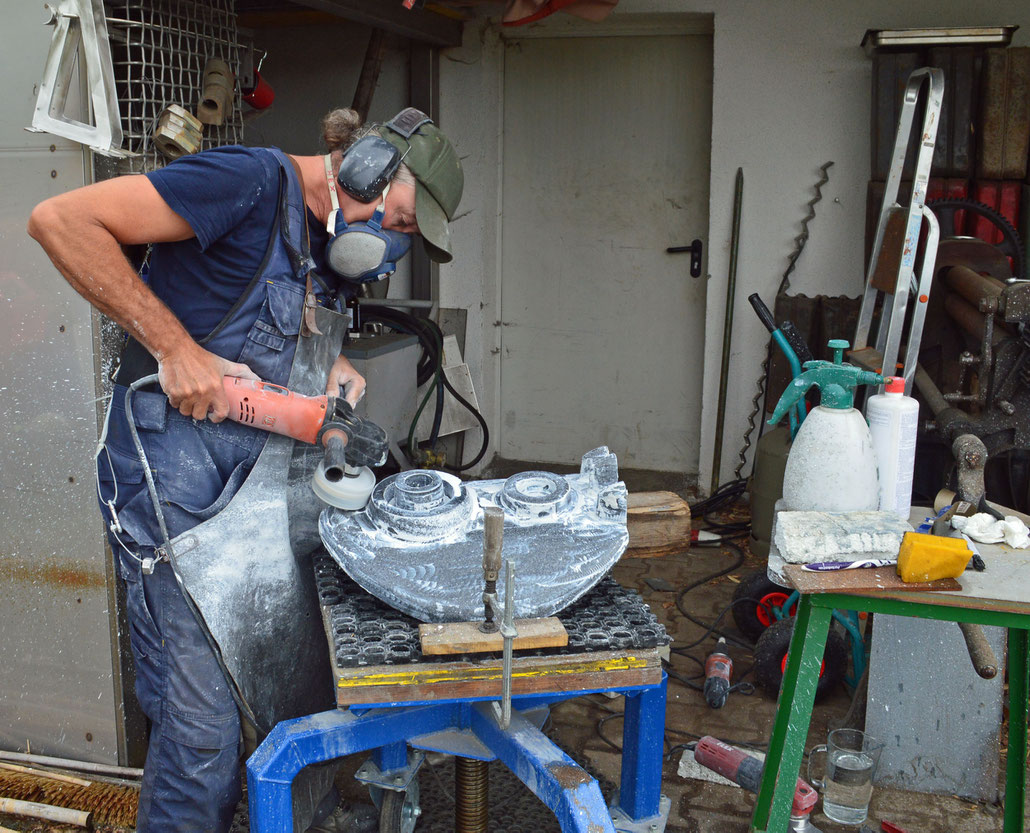 Sculptor HEX working on an abstract sculpture called PAGAN MASKS in black granite. ABBY HIGNELL has a gallery in London. HEX is a Fellow of the Royal British Society of Sculptors