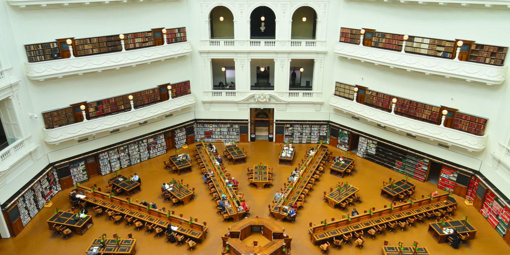 State Library of Victoria's La Trobe Reading Room in Melbourne, Australia. Its grand octagonal design, high bookshelves, and study desks create an iconic scholarly atmosphere.