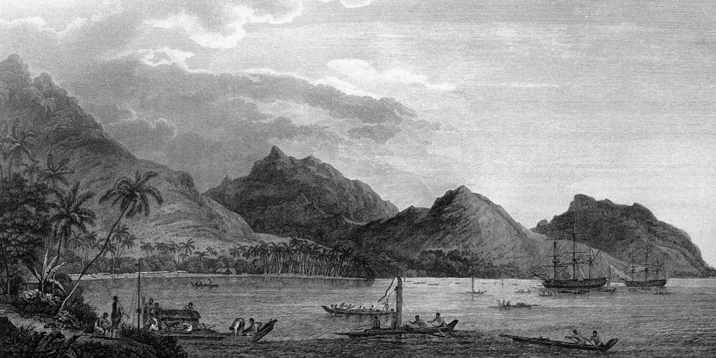 A detailed engraving of a tropical bay with towering mountains, palm trees, and native canoes. European sailing ships anchor offshore, while islanders engage in daily activities near the shore.