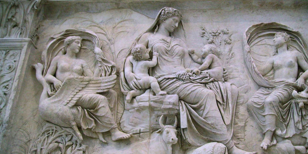 A relief from the Ara Pacis, an ancient Roman altar dedicated to Pax, the goddess of peace. The scene symbolizes prosperity, fertility, and Rome's divine favor under Augustus.