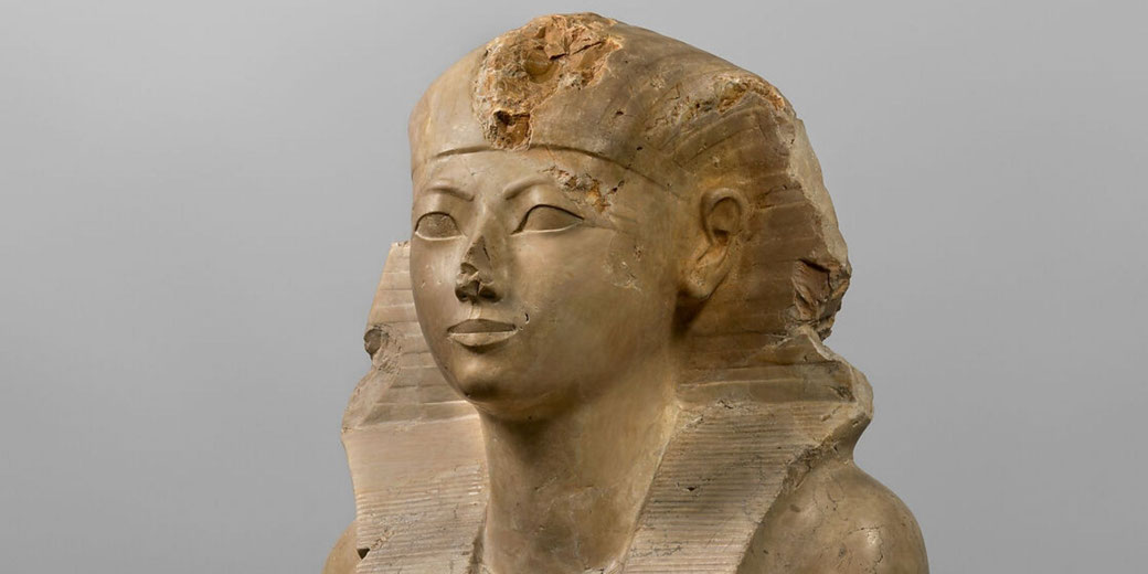 Hatshepsut sits as pharaoh in the nemes headcloth and royal kilt, giving students a clear image of her kingly presentation.