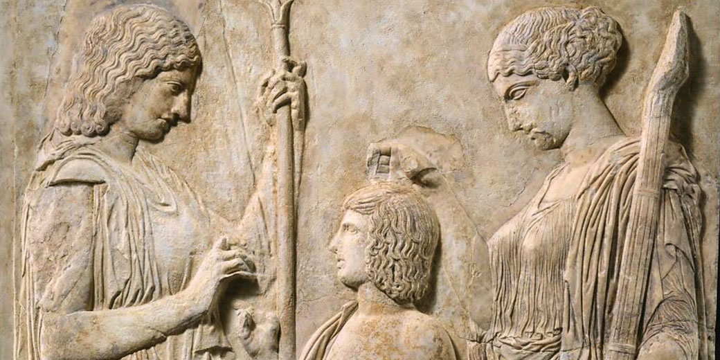 Marble relief showing Demeter, Persephone, and Triptolemos, linked to the Eleusinian Mysteries.