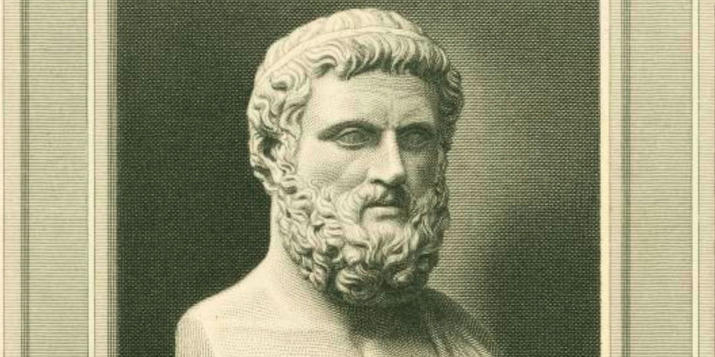 Engraving of a bust showing a bearded man with wavy hair and a headband, facing slightly to the left.