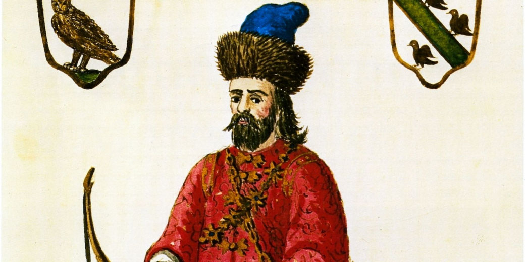 Illustration of a bearded man in a fur hat and red robe, painted in a medieval manuscript style with bird emblems above him.