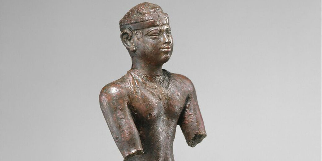 Bronze figure of a kneeling Kushite king wearing a cap crown, with altered uraei and removed amulets.