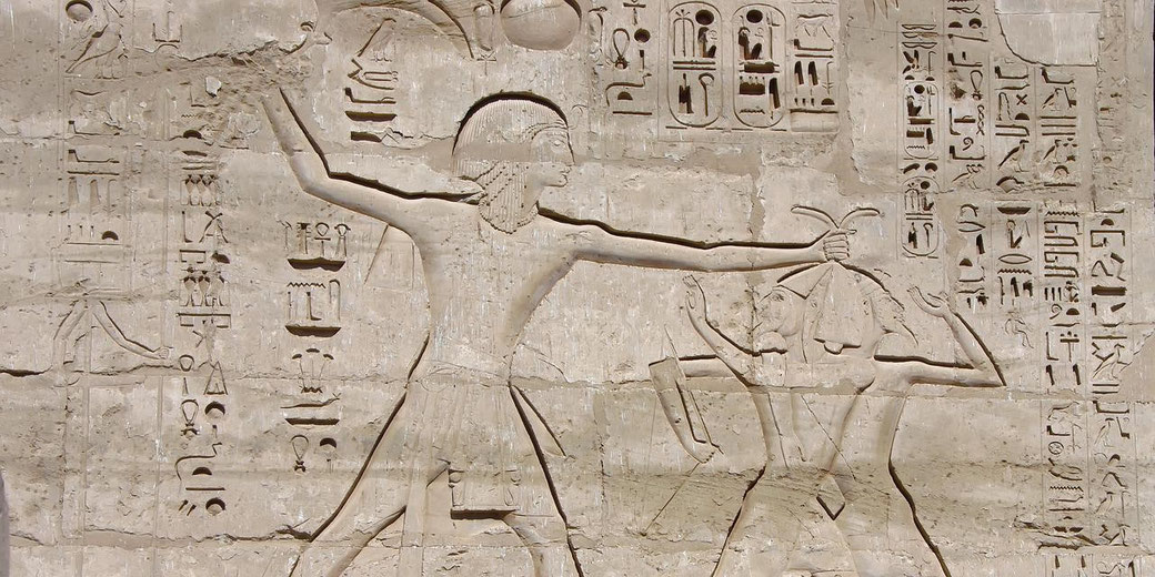 Carving of pharaoh defeating his enemies