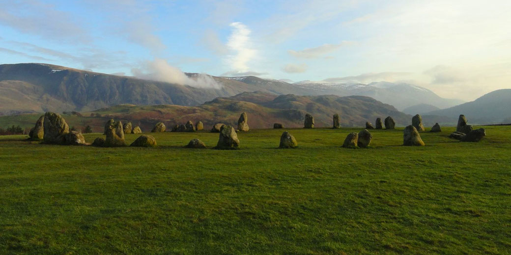 Castlerigg Stone Circle in England’s Lake District. This prehistoric site, dating to around 3000 BC, features a ring of standing stones set against a scenic mountain backdrop.