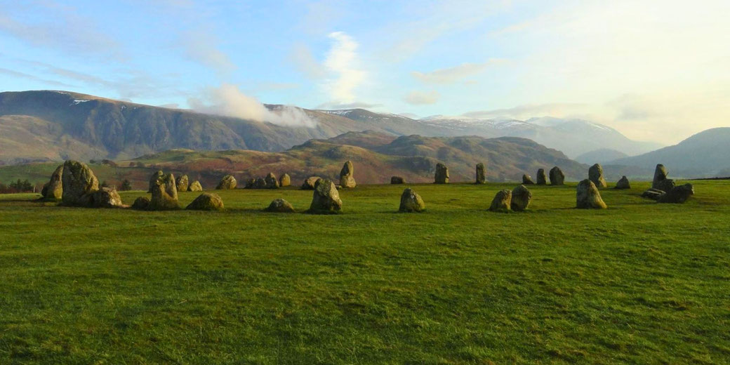 Castlerigg Stone Circle in England’s Lake District. This prehistoric site, dating to around 3000 BC, features a ring of standing stones set against a scenic mountain backdrop.