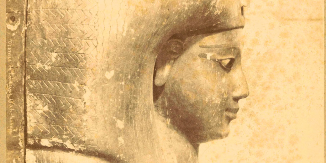 A mid‑19th century albumen photograph by Théodule Dévéria showing a side view of Queen Ahhotep’s sarcophagus, printed on paper with cardboard support.