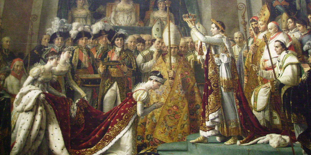 Napoleon crowns Empress Joséphine in a lavish ceremony surrounded by clergy, nobles, and dignitaries in richly detailed royal attire.
