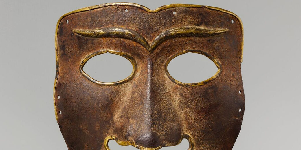 An iron battle mask with Mongolian or Tibetan features, made to protect a warrior’s face during combat.