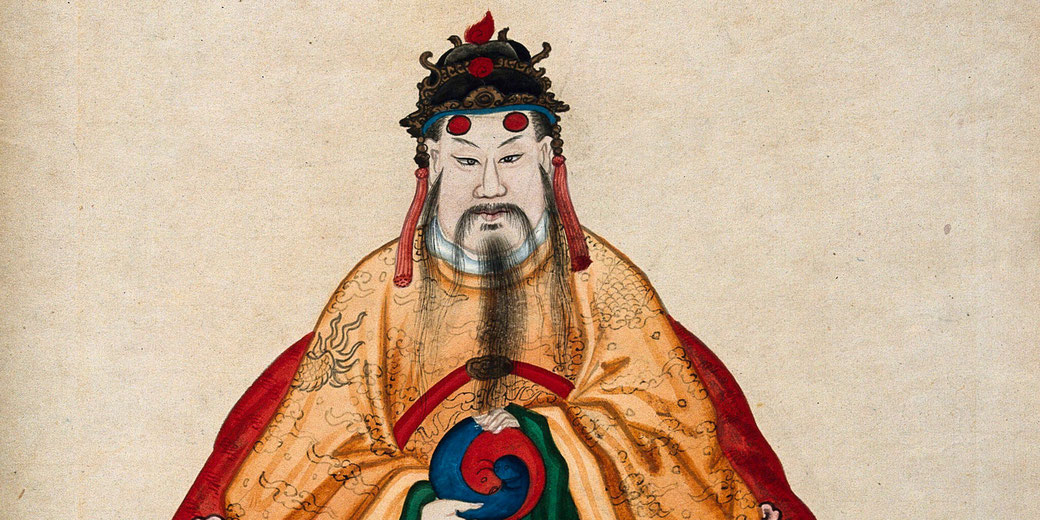 Emperor Fu Hsi, wearing an ornate golden robe and an elaborate headdress. He holds a yin-yang symbol.