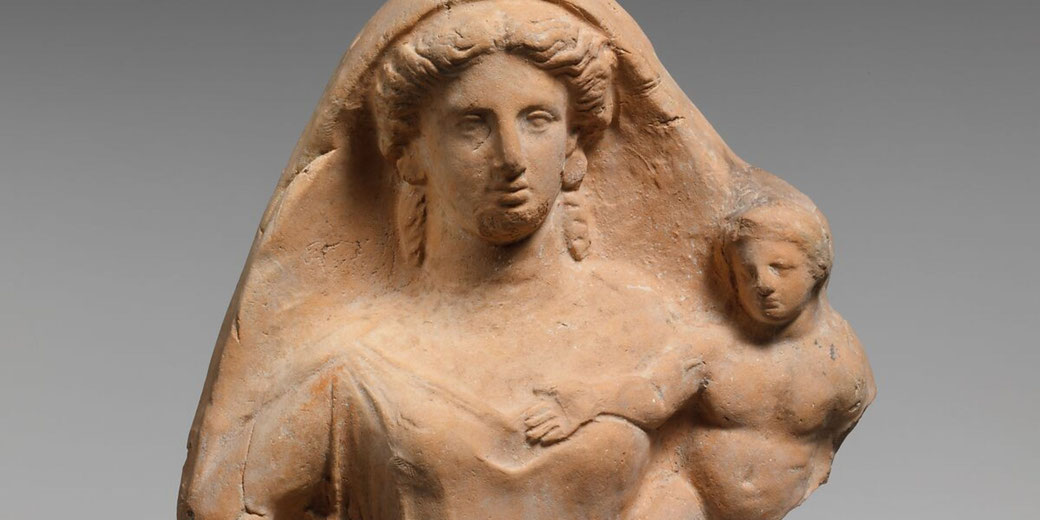 Terracotta relief showing a woman holding a child, possibly Persephone and Iakchos, from a larger scene with Dionysos.