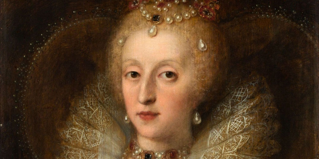 A portrait of a noblewoman with pale skin, wearing an elaborate pearl-adorned headdress, a ruffled lace collar, and jeweled accessories.