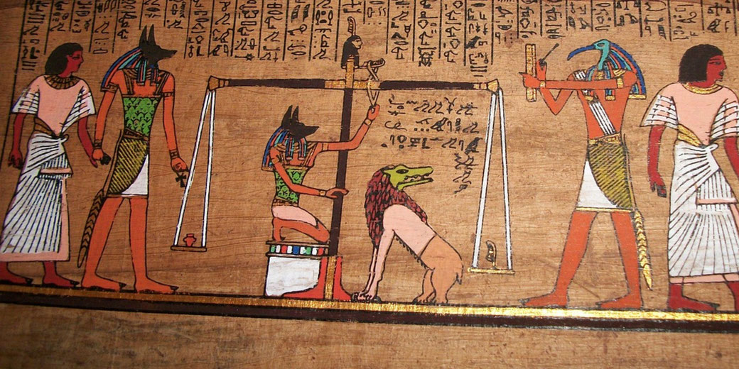 An ancient Egyptian papyrus illustration depicting the "Weighing of the Heart" from the Book of the Dead. Anubis weighs a heart against a feather, while Thoth records and Ammit waits to devour the unworthy.