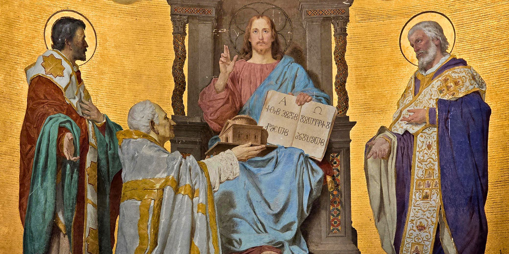 A central enthroned figure of Christ in blue and red robes holds an open book inscribed with Greek text and raises his hand in blessing, flanked by two haloed bishops against a gold background.