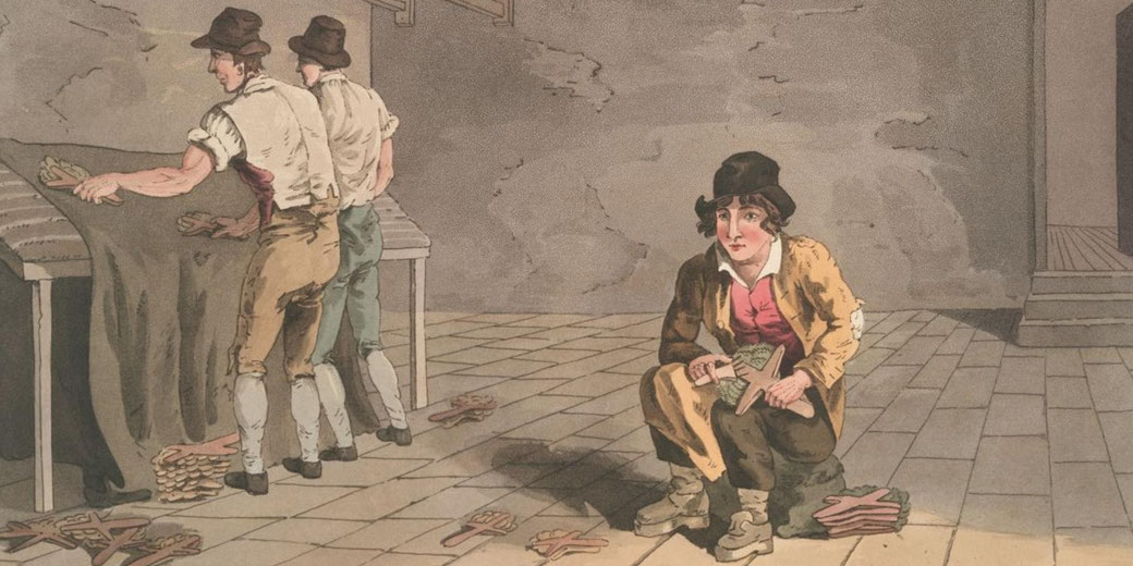 Vintage illustration of workshop workers cutting human-shaped pieces from material on a table while a woman crouches nearby stacking the cutouts on a tiled floor.