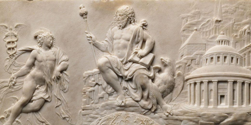 Intricate marble relief showing a seated Zeus with scepter and eagle, and Hermes with caduceus, set against a backdrop of classical architecture.