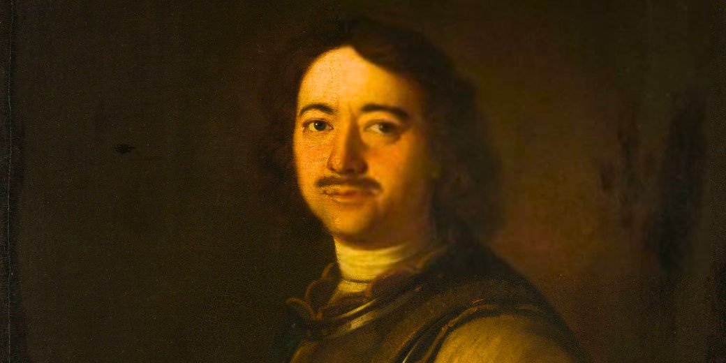 A man with a faint mustache and long hair in a dimly lit portrait wears dark armor and a white collar.